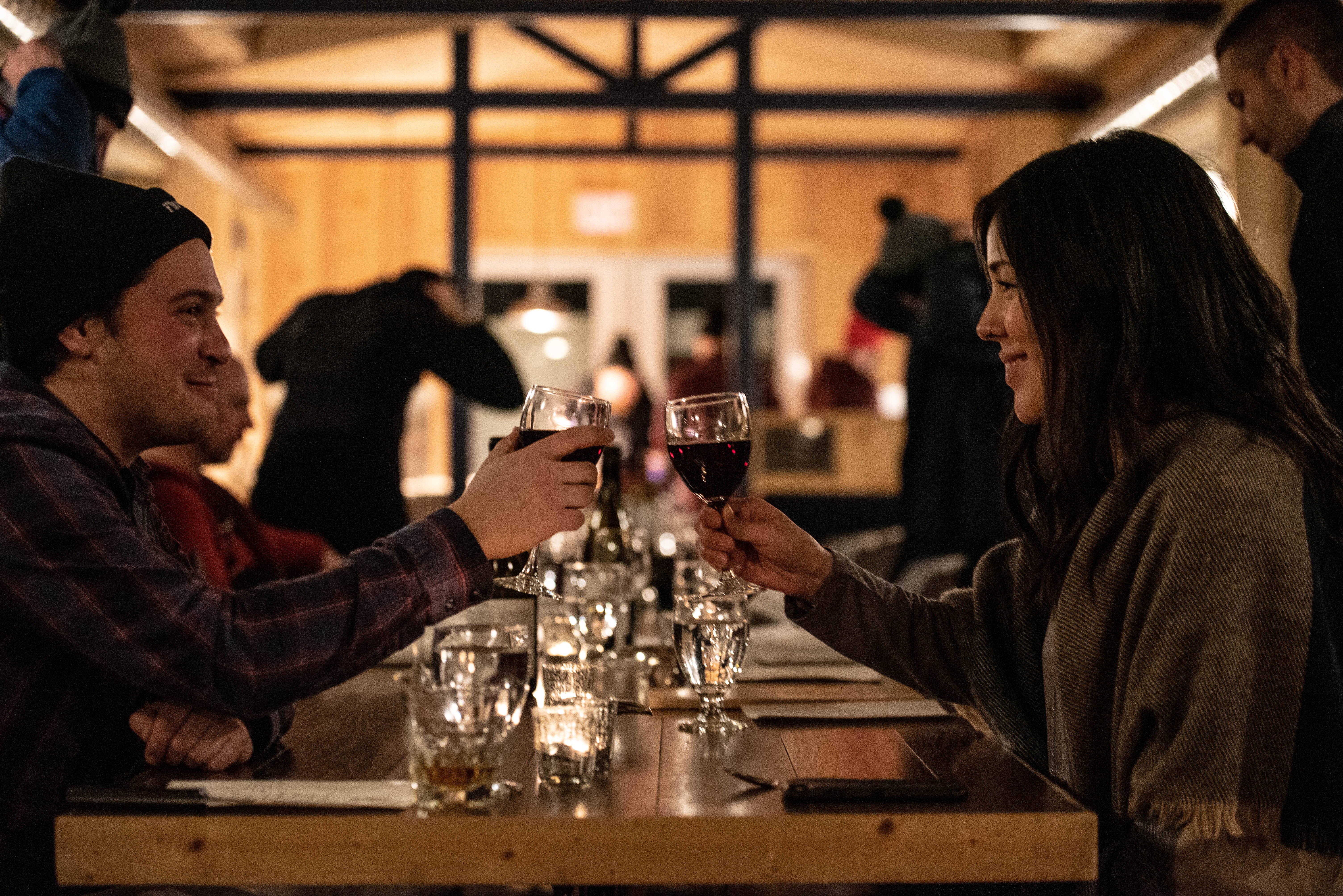 A couple enjoying dinner beneath the northern lights at Dan's Diner in Churchill, Canada.