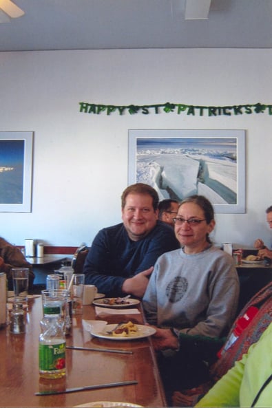 A couple in a diner.