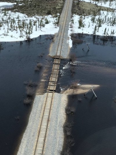 An aerial photo of washed out train tracks.