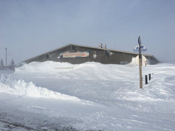 A photo of the Seaport Restaurant with snow nearly to the roof.