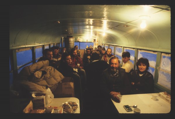 A group of pioneering guests enjoys drinks in the original Tundra Buggy&reg;