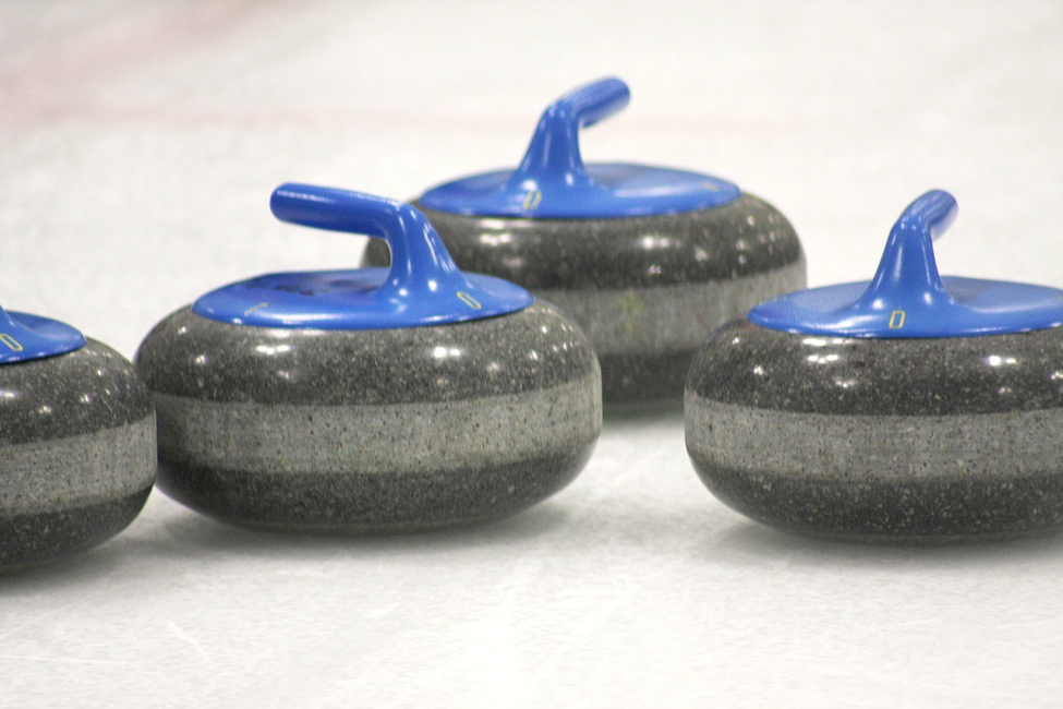 Curling rocks resting on ice