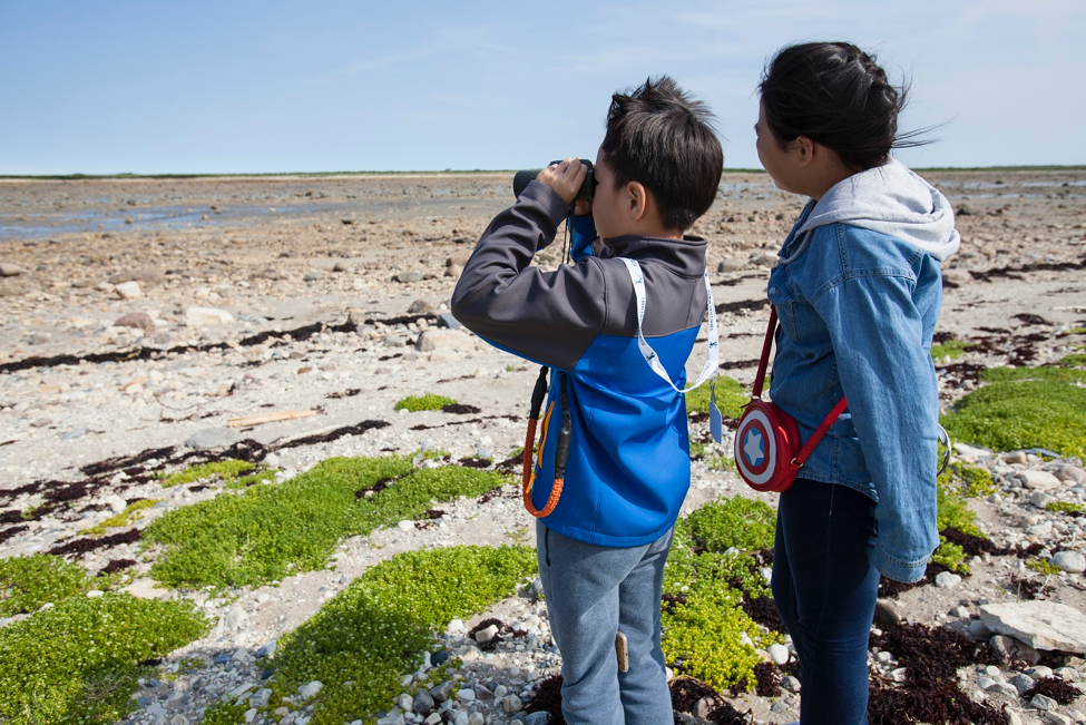 Kids overlooking the tidal flats in Churchill.